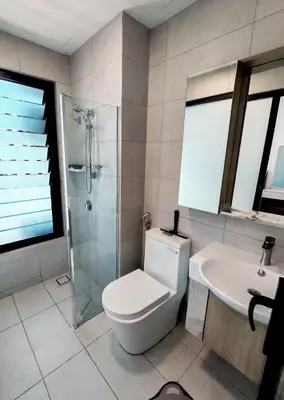 a bathroom with a toilet and a sink and a shower at Brand NEW Modern Cozy Retreats 3BR2B2P for 6 in Batu Kawan