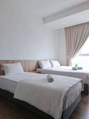 a bedroom with two beds and a window at Cozy Homestay - Ipoh Garden in Ipoh