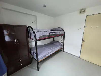 a small room with two bunk beds and a mirror at Mingle 7 Hostel Georgetown Penang in George Town