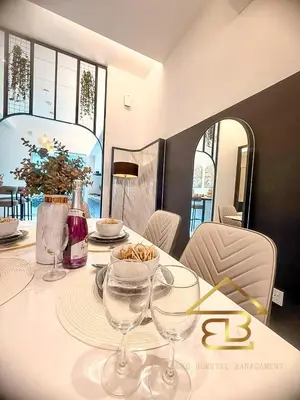 a dining room table with wine glasses on it at GatherLuxe Ipoh, Landed 14Pax, KTV, Kids Room, Baby Cot in Chemor
