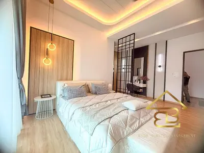 a bedroom with a large bed in a room at GatherLuxe Ipoh, Landed 14Pax, KTV, Kids Room, Baby Cot in Chemor