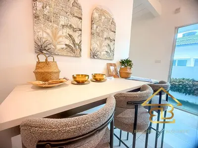 a dining room with a table and chairs at GatherLuxe Ipoh, Landed 14Pax, KTV, Kids Room, Baby Cot in Chemor