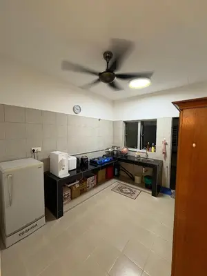 a kitchen with a ceiling fan in a room at Homestay AtinAya in Tanjung Rambutan