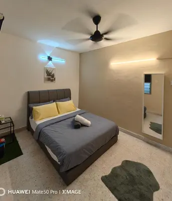 a bedroom with a bed and a ceiling fan at TL Legend Homestay2 - 4 bedroom single story house in Ipoh