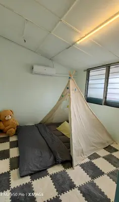 a teddy bear sitting next to a tent in a room at TL Legend Homestay2 - 4 bedroom single story house in Ipoh