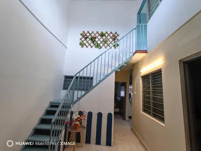a stairway in a house with a blue and white staircase at TL Legend Homestay2 - 4 bedroom single story house in Ipoh
