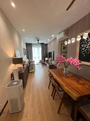 a living room with a wooden table and a living room at Middle Room Only in Bayan Lepas Share Space in Bayan Lepas