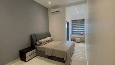 a small bedroom with a bed and a window at 52 Homestay Pangkor in Pangkor