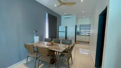 a dining room with a table with chairs and a ceiling at 52 Homestay Pangkor in Pangkor