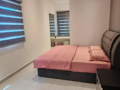 a bedroom with a bed with pink sheets and a window at 52 Homestay Pangkor in Pangkor