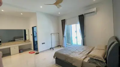 a bedroom with a bed and a flat screen tv at 52 Homestay Pangkor in Pangkor
