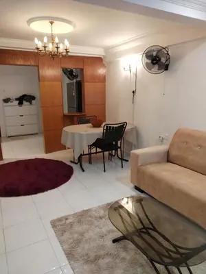 a living room with a couch and a table at Ed 03 lumut Waterfront in Lumut