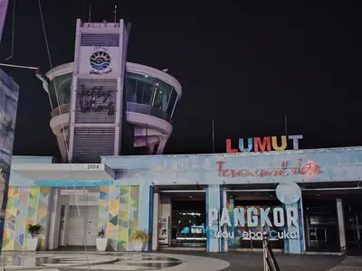 a building with a clock tower on top of it at Ed 03 lumut Waterfront in Lumut