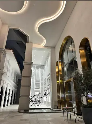 a lobby of a building with a spiral ceiling at 22 Macalisterz 2025 Georgetown Premium \u9876\u697c\u65e0\u8fb9\u6cf3\u6c60 in George Town