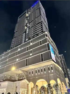 a tall building with a sign on top of it at 22 Macalisterz 2025 Georgetown Premium \u9876\u697c\u65e0\u8fb9\u6cf3\u6c60 in George Town