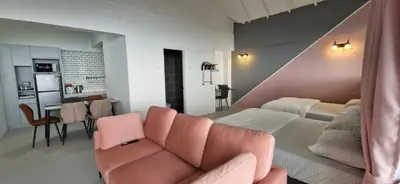 a living room with a couch and a bed at A3-6-1Silverpark LuxMountsin view Lifted unit in Bukit Fraser