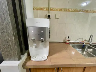 a coffee maker on a counter next to a sink at Inap by KF in Bayan Lepas
