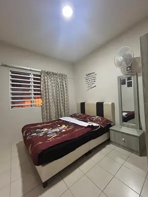 a bedroom with a bed and a mirror at Harry Potter Homestay Cameron Highlands in Tanah Rata
