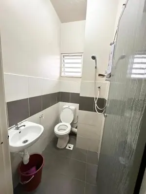 a bathroom with a toilet and a sink at Harry Potter Homestay Cameron Highlands in Tanah Rata