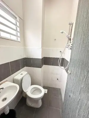 a bathroom with a toilet and a sink at Harry Potter Homestay Cameron Highlands in Tanah Rata