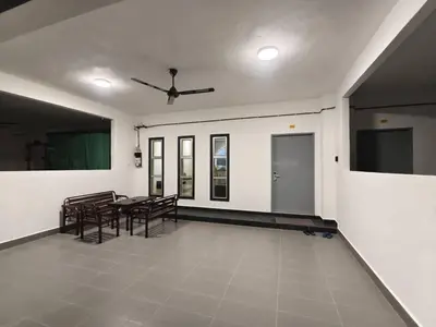 a dining room with chairs and a table in a room at Hello Pangkor Home 73A - A Nest for 12 buddies in Pangkor