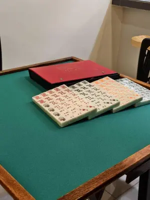 two remote controls sitting on top of a table at Hello Pangkor Home 73A - A Nest for 12 buddies in Pangkor