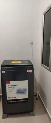 a refrigerator sitting on the floor in a room at Hello Pangkor Home 73A - A Nest for 12 buddies in Pangkor