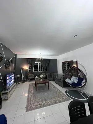 a living room with a couch and a tv at Dheaa's Homestay Cameron Highlands in Tanah Rata