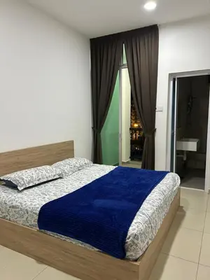 a bedroom with a bed with a blue blanket at Ereens guest house Cameron highland in Brinchang