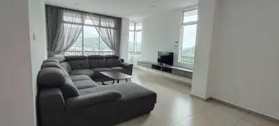 a living room with a couch and a tv at Ereens guest house Cameron highland in Brinchang