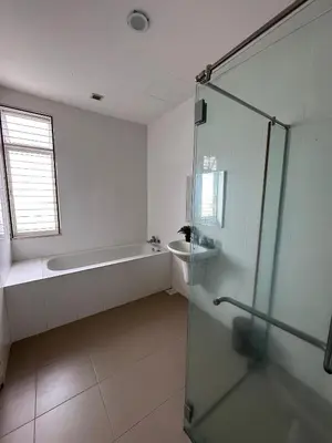 a bathroom with a bath tub and a sink at Shamrock By Island Hospitality in Batu Ferringhi