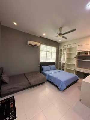 a bedroom with a bed and a couch at Shamrock By Island Hospitality in Batu Ferringhi