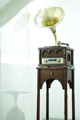 a wooden table with a radio on top of it at Comfy Sofy-Bunny Vintage Penthouse in Tanah Rata