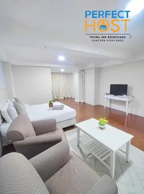a living room with a couch and a table at Triima Inn Brinchang by Perfect Host in Brinchang