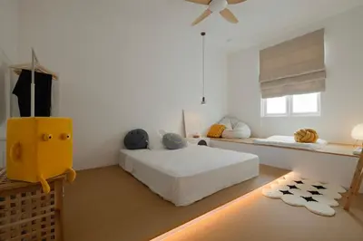 a white bedroom with a bed and a window at Muji Style Minimalist Room Only NOT STUDIO in Bukit Mertajam