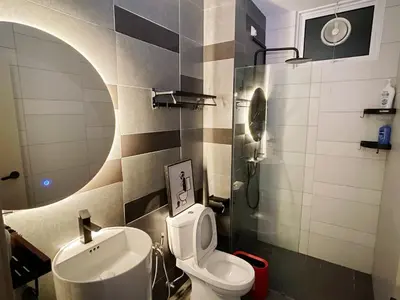a bathroom with a sink and a toilet and a mirror at Muji Style Minimalist Room Only NOT STUDIO in Bukit Mertajam
