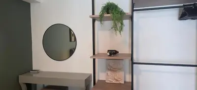 a room with a mirror and a table and a mirror at Maritime Suite with Seaview 2BR - Water Dispenser - Dryer in George Town