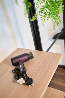 a gun sitting on top of a table at Maritime Suite with Seaview 2BR - Water Dispenser - Dryer in George Town