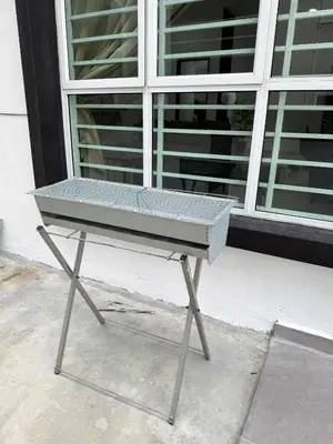 a ping pong table sitting in front of a window at Sekinchan 2008 Homestay KaraokeBBQ 20pax \u4e09\u5c42\u7b80\u7ea6\u98ce\u540d\u5bbf in Sekincan