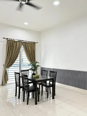 a dining room with a table and chairs and a window at Sekinchan 2008 Homestay KaraokeBBQ 20pax \u4e09\u5c42\u7b80\u7ea6\u98ce\u540d\u5bbf in Sekincan