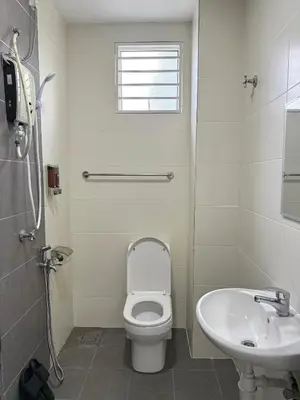 a white bathroom with a toilet and a sink at Sekinchan 2008 Homestay KaraokeBBQ 20pax \u4e09\u5c42\u7b80\u7ea6\u98ce\u540d\u5bbf in Sekincan