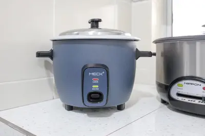 a slow cooker sitting on a counter next to a slow cooker at Serenity Retreat, Nature & Comfort Stay Brinchang Cameron Highland -Clover Home 5-21 in Brinchang