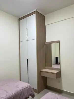 a bedroom with a mirror and a bed at Highland Chill Retreat in Tanah Rata