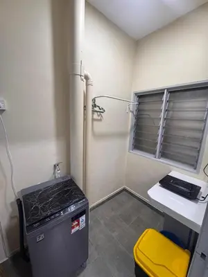 a small kitchen with a stove and a window at Highland Chill Retreat in Tanah Rata