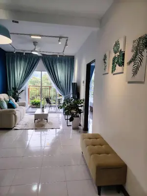 a living room with a couch and a large window at Hygee Home At Emerald Avenue Brinchang in Brinchang