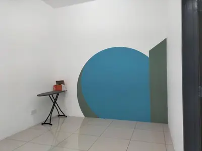 a room with a blue circle on the wall at Cozy 4 bedrooms Double Storey Homestay, in front Kulim Central Mall in Kulim