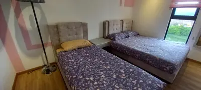 a bedroom with two beds in a room at End Unit, The Cove Residence, Tambun 8 pax in Ipoh