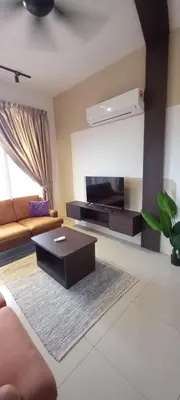 a living room with a couch and a coffee table at End Unit, The Cove Residence, Tambun 8 pax in Ipoh