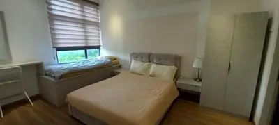 a small bedroom with a bed and a window at End Unit, The Cove Residence, Tambun 8 pax in Ipoh
