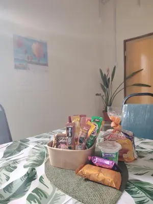 a basket of food and snacks on a table at Fantasy Stay Cameron Highlands in Kampung Kuala Terla